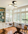 3 Light Dimmable LED Semi Flush Mount Ceiling Light Fixture In Modern Gold And Black in a cozy living room setting