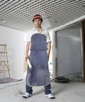 Top Notch Cowhide Welding Apron Replacement For Heat Resistant Protection That Fits Snugly Allows Movers To Work Freely On Any Job Site Without Worry worn by a worker in a construction site.