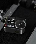 Light Meter With OLED Display And Cold Shoe Mount For Cameras Dial In ISO Aperture And Shutter Speed Ultra Lightweight Bronze Plate At 59g Fits Vintage Leicas And Rangefinder Film Cameras Great For Analog Shoots, top view on camera