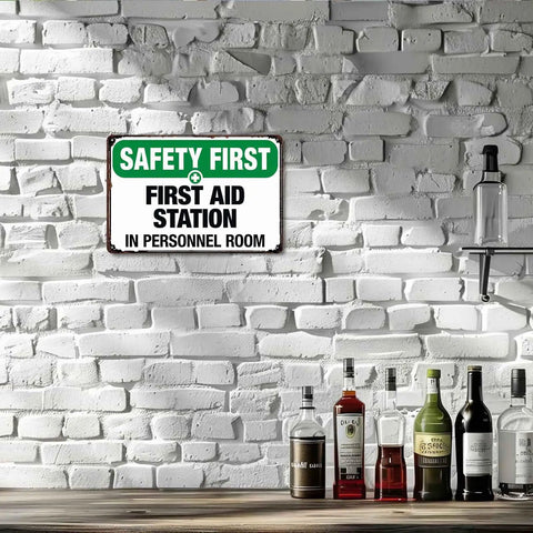 First Aid Station Aluminum Sign 8x12 Inches Built Tough Weatherproof Metal Sign on white brick wall in personnel room.