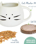 Organic Cat Grass Kit For Indoor Cats With Seed Mix Soil And White Planter Hairball Control And Digestion Support Easy Grow Kit For Cats Perfect Gift For Cat Lovers featuring a cat-shaped white planter, seeds, and a soil disk.
