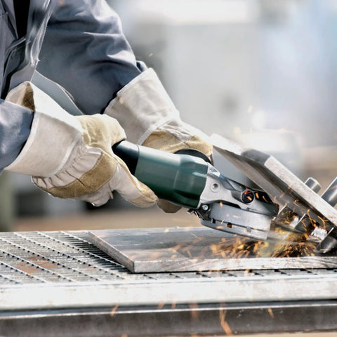 Flat Head Angle Grinder 4 1/2 to 5 Inch With 8 Amp Motor Aluminum Gearbox in use for metal grinding, showing sparks.