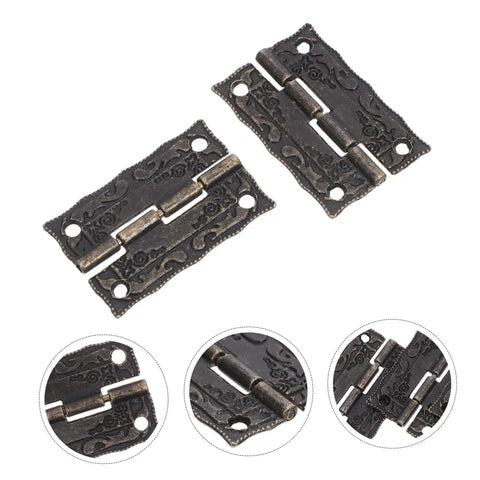 Detailed view of vintage bronze cabinet hinges with screws for wooden boxes and jewelry cases decorative chest hardware.