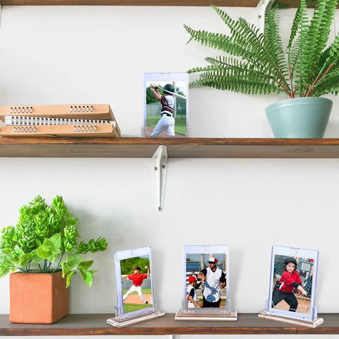 4 Pack Magnetic Card Holder Base For Trading Cards Display Stand Protector Case Base Perfect For Baseball Cards And Standard 35Pt Card Holders Great For Collectors To Show Off Your Favorite Cards At Home Or In The Office shown in use on wall shelves with photos.