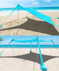 Beach Tent Sun Shelter 10x10ft Pop Up Canopy With UPF50 Plus Shade, sandbags, and windproof poles set up on the beach.