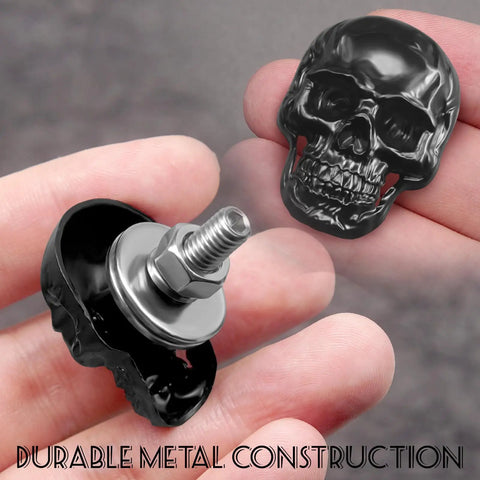 Hand holding a Dope Skull License Plate Screws Kit With 8 Skull Bolts 8 Nuts 8 Spring Washers 16 Flat Washers And Hex Driver