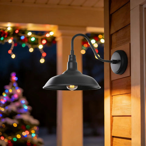Gooseneck Barn Lights 10 Inch Black Exterior Wall Mount Sconce Set illuminated outdoors, highlighting farmhouse style at night.