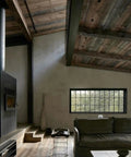 Cozy living room with a high wooden ceiling, featuring a Top Shelf Water Based Reactive Wood Stain Delivers A Real Deal Aged Barrel Finish.