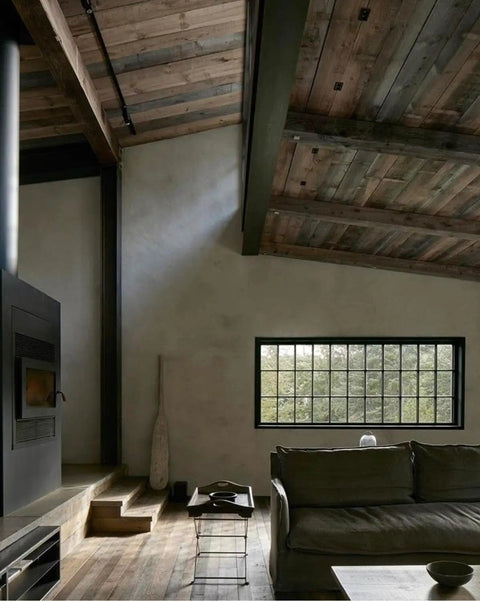Real Deal Aged Brown Wood Stain Delivers Kickass Weathered Depth On All Surfaces with rustic wooden beams and a cozy living room setup.