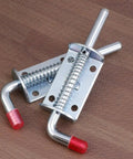 Spring Pin Latch Lock 2pcs for Utility Trailer Gate, Silver with red rubber tips on hooks, detailed view on wood background.