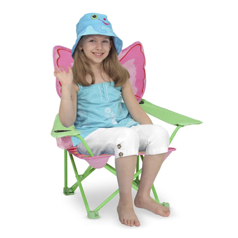 Girl sitting on kid sized butterfly back folding chair with built in cup holder in armrest, storage bag, pink and green butterfly theme