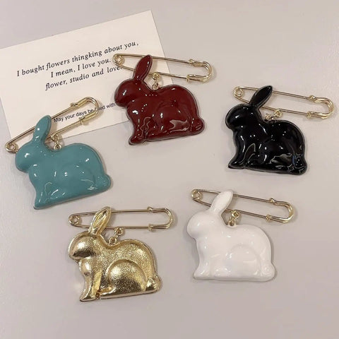 Absolute Fire Dangling Rabbit Safety Pin Lapel Brooch For Women And Men, colorful bunny pins with safety pins on display.