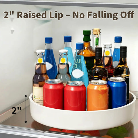 Large Capacity Lazy Susan Organizer For Pantry Cabinet And Kitchen Storage Featuring Super Slick 360 Spinner Turntable Spice Rack With Non Slip Base And Raised Lip Saves Serious Space While Making Daily Meal Prep A Total Piece Of Cake with 2-inch raised lip and assorted bottles in refrigerator.