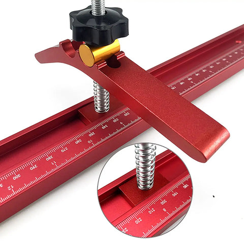 Hilitand T Track Hold Down Clamp Is The Real Deal For Adjustable Metal Clamps securing wood with a metal ruler on a workbench.