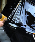 Pro Heat Gun For Auto Vinyl Wrapping With Precision Nozzle And 3M Toolkit Included 1200W Power in use on car with black vinyl wrap