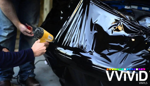 Pro Heat Gun For Auto Vinyl Wrapping With Precision Nozzle And 3M Toolkit Included 1200W Power in use on car with black vinyl wrap