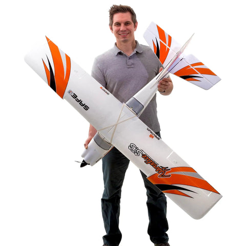 Man holding big 1.5 meter RC airplane trainer with Safe Flight System, BNF Basic, easy to fly for beginners at the club field.