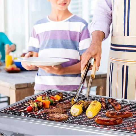 Family using Portable Stainless Steel Charcoal Grill Folding Outdoor Barbecue Kit for camping and picnics with food