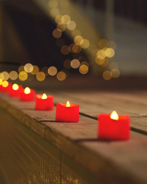 Red LED Tea Lights Battery Operated Flameless Candles, 200 Hours Of Flickering Safe Fake Candles on wooden surface, 24 Pack