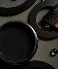 Open can of Chalk Mineral Furniture Paint Matte Black Caviar 16oz with brush for DIY makeovers on wood, metal, plastic.