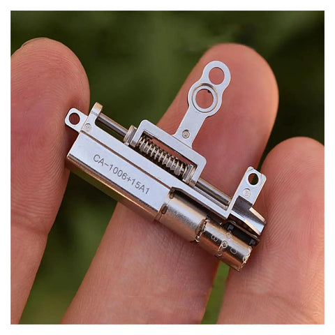 Close-up of 11.5mm Stroke Linear Actuator With 5mm Precision Planetary Gearbox Pro Grade, 2 Phase 4 Wire Stepper Motor on fingers.