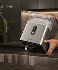 Nugget Ice Maker Countertop With 35 Lbs Per Day Fast Ice In 7 Minutes shown being drained over a kitchen sink