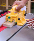 Premium Adjustable 3D Woodworking Push Block Featuring Grippy Non Slip Pads And Detachable Leg To Shield Your Knuckles From Wild Table Saw Blades in use at table saw.