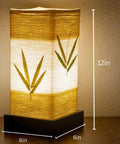 Japanese Lantern Bamboo Table Lamp With Cherry Blossom Accent Dimmable Nightstand Light 6x12 inches on wooden table