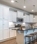 Modern kitchen setting with white cabinets featuring Crystal Glass Drawer Knobs 25 Pack Diamond Shaped 30mm with Silver Base