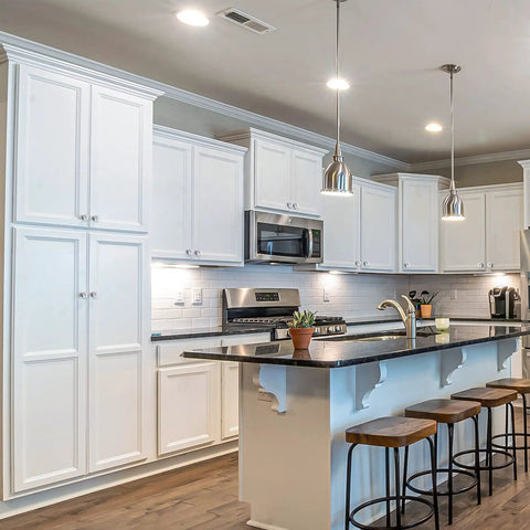 Modern kitchen setting with white cabinets featuring Crystal Glass Drawer Knobs 25 Pack Diamond Shaped 30mm with Silver Base