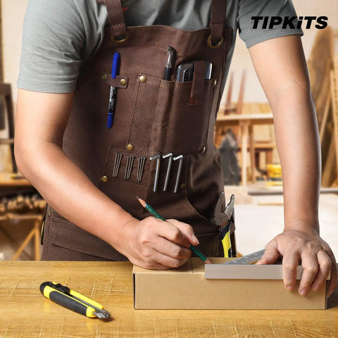 Woodworking Apron With 9 Tool Pockets And Magnetic Chest Holders, 20 Oz Waxed Canvas Apron in use by a carpenter drawing.