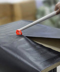 Vinyl Wrap Tool Kit For Car Wrapping And Window Tinting With 4 Inch Felt Squeegee being used on carbon fiber vinyl sheet