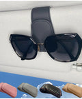 Slick Magnetic Leather Sunglass Holder For Cars That Snaps Right Onto Your Visor to secure sunglasses with stylish black design.
