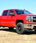 Red Chevy 1500 with 2 Inch Red Aluminum Leveling Kit For Chevy And GMC 1500 2007 To 2018 Level Front To Rear Beefed Up Ground Clearance