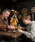 Father and son assembling Steampunk Diver Building Set For Adults With 1287 Pieces, Deep Sea Explorer Robot Model on a table.
