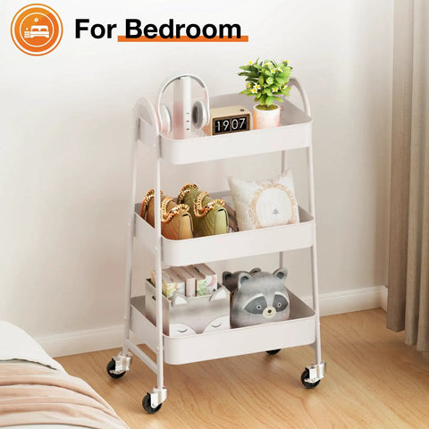 3-Tier Rolling Utility Cart With Locking Wheels For Small Spaces in white, used for bedroom storage, featuring swivel wheels.