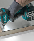 Powerhouse 18V LXT Brushless Cordless Impact Driver Kit With 4.0Ah Battery in use on wooden panel