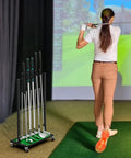 Sturdy Ten Club Golf Storage Rack Stand For Garage And Home Golf Simulator Holds Ten Clubs shown with golfer in simulator