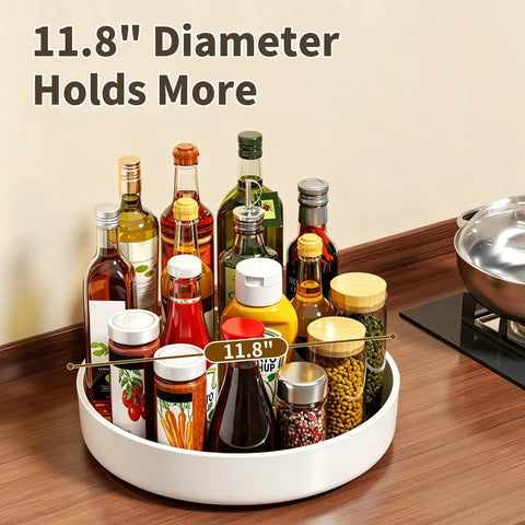 Large Capacity Lazy Susan Organizer For Pantry Cabinet And Kitchen Storage Featuring Super Slick 360 Spinner Turntable Spice Rack With Non Slip Base And Raised Lip Saves Serious Space While Making Daily Meal Prep A Total Piece Of Cake, displaying various sauces and spices on a sleek white 11.8-inch diameter turntable.