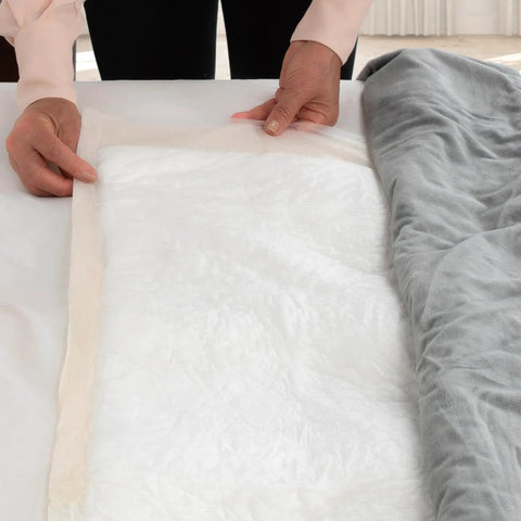 Hella Soft Disposable Underpads For Adults And Elders Xxl Leakproof Incontinence Bed Pads 30By30 Beige being placed on a bed.