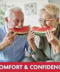 Elderly couple enjoying watermelon with secure comfort from Original Flavor Denture Adhesive Seal For Lower Dentures, Zinc Free, All Day Hold.