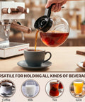 Pro Level Thermal Resistant Glass Coffee Pots 4 Pack 10 Cup 57 Oz Replacement Carafes For Commercial Brewers With Slick Black Handles pouring coffee into a cup.