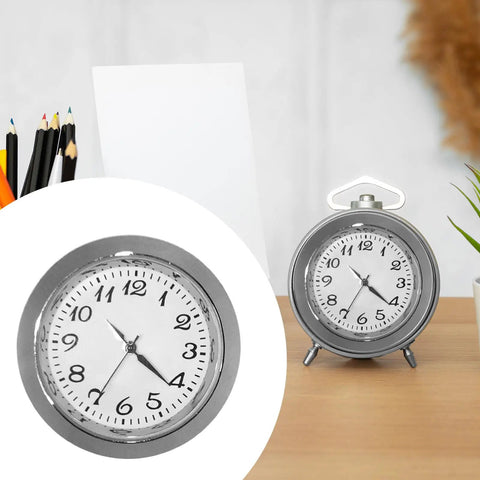 Clock Insert Kit 1-7/16 Inch Dial Fits 1-3/8 Inch Hole with white face and black numerals on a desk