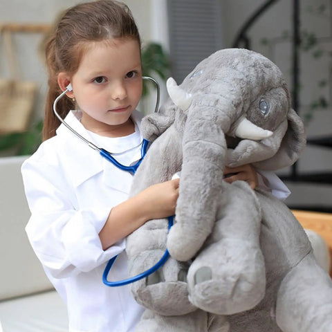 Child in Kids Lab Coat Doctor Costume For Halloween And Career Day Realistic White Coat For Boys And Girls Ages 7 To 9 examining toy elephant
