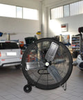 30 Inch Beastly High Velocity Drum Fan in a garage setting, showcasing industrial use for workshops and warehouses
