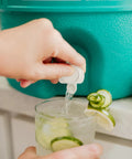 Retro 2 Gallon Party Water Jug Cooler Jade Finish With Eco Friendly THERMECOOL Foam Insulation, BPA Free, Drip Resistant Push Spigot in use