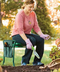 Woman using Versatile Garden Kneeler And Seat Foldable Bench With Tool Pouch And Soft Kneeling Pad in a garden setting