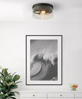 2 Light Flush Mount Ceiling Light In Matte Black With Brass Accents And Clear Glass Shade in modern room with wall art