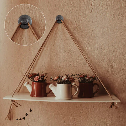 Double Headed Push Pins For Picture Hanging And Photo Decor holding a hanging shelf with teapots on a wall.