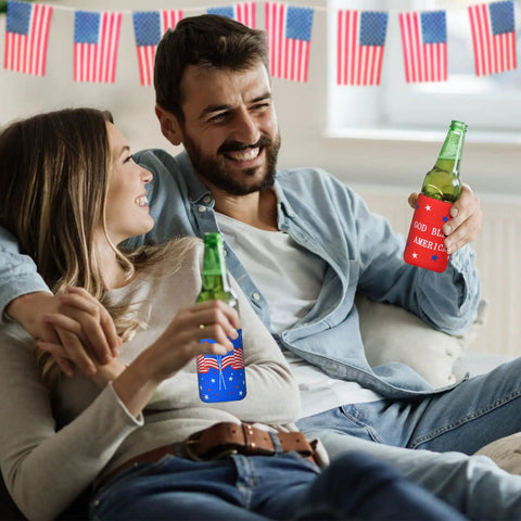 Couple sitting with Red White Blue Can Cooler Sleeves 12 Pack For Fourth Of July Independence Day Party Favors, indoors.